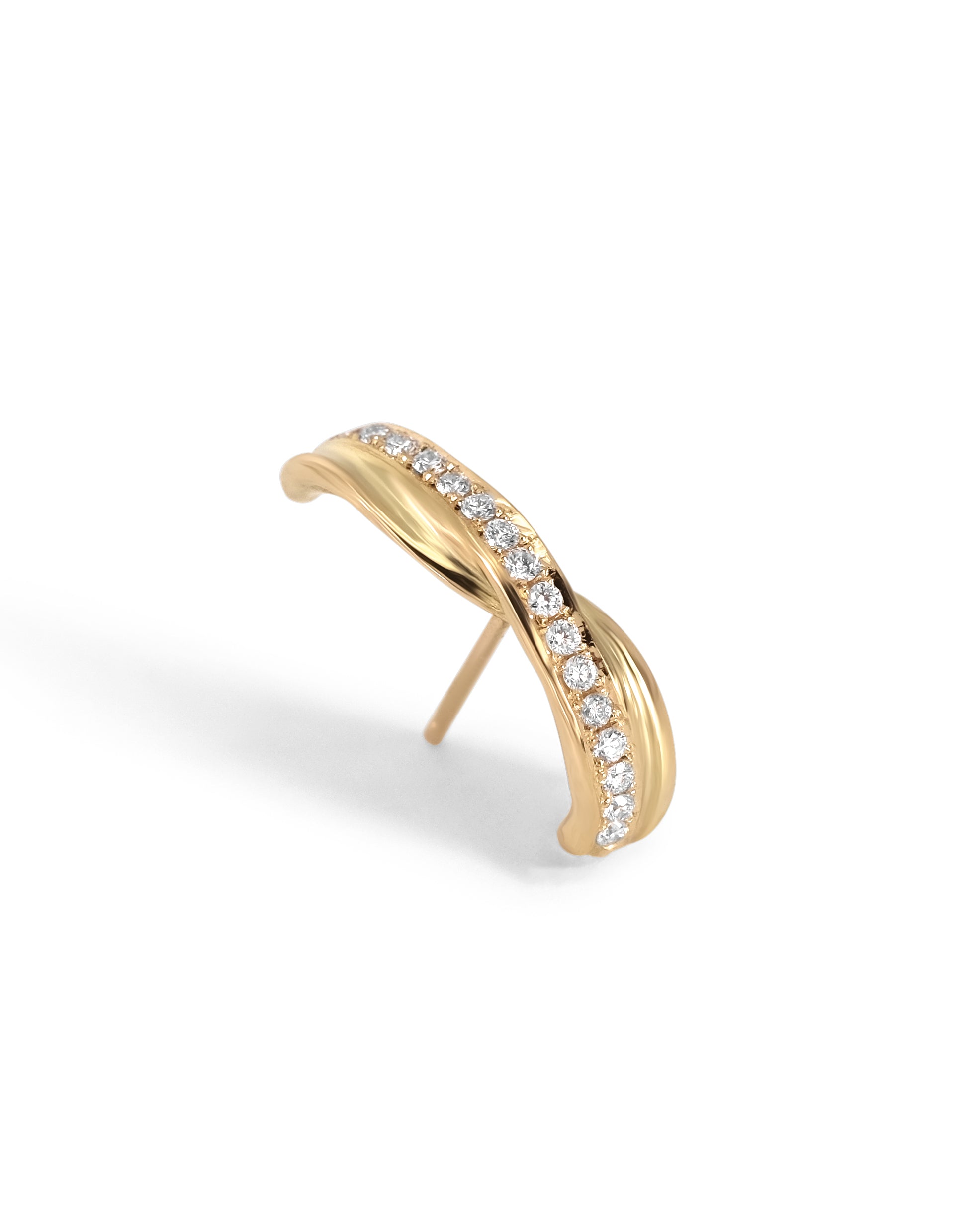 A gold single ear huggie with a single row of pavé-set white diamonds along the front curve, shown on a clean white background.
