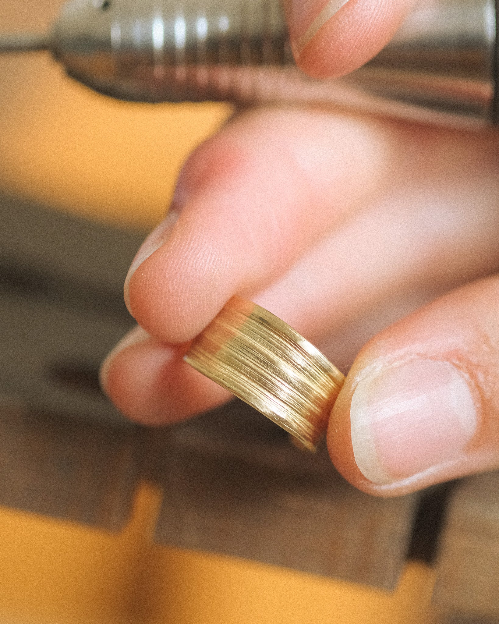 Hand working on Komorebi Hoops