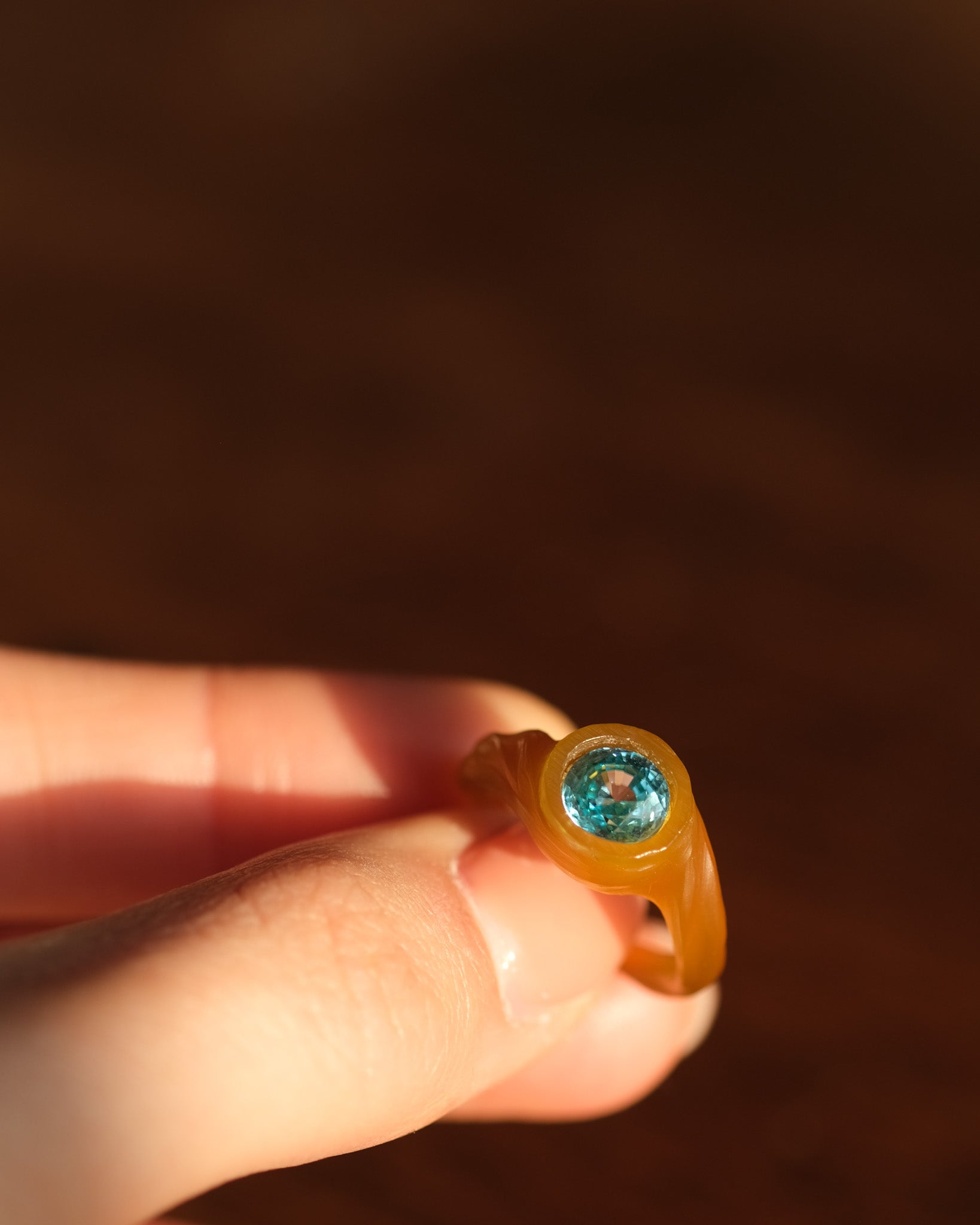 Hand holding a zircon ring made in ewax