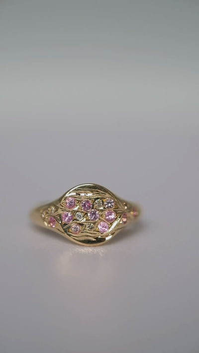 Hand set and engraved pinky signet ring with pink natural sapphires, champagnes and white diamonds.